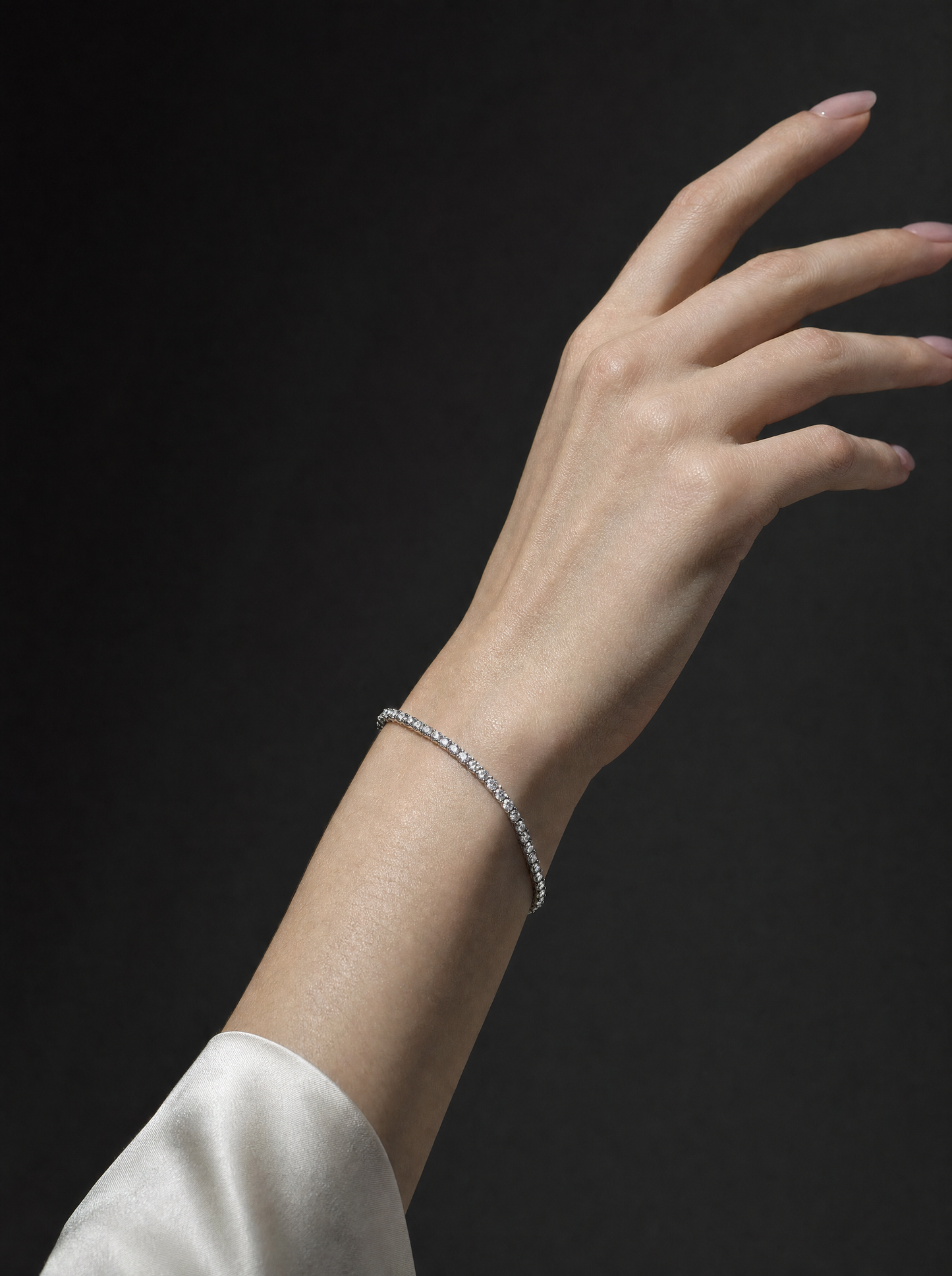 Womens dainty tennis bracelet on model, editorial