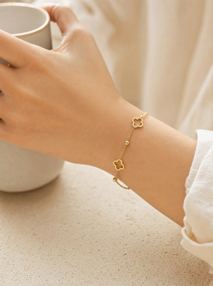 Four-leaf clover chain bracelet, 18K gold plated, on-wrist detail angle