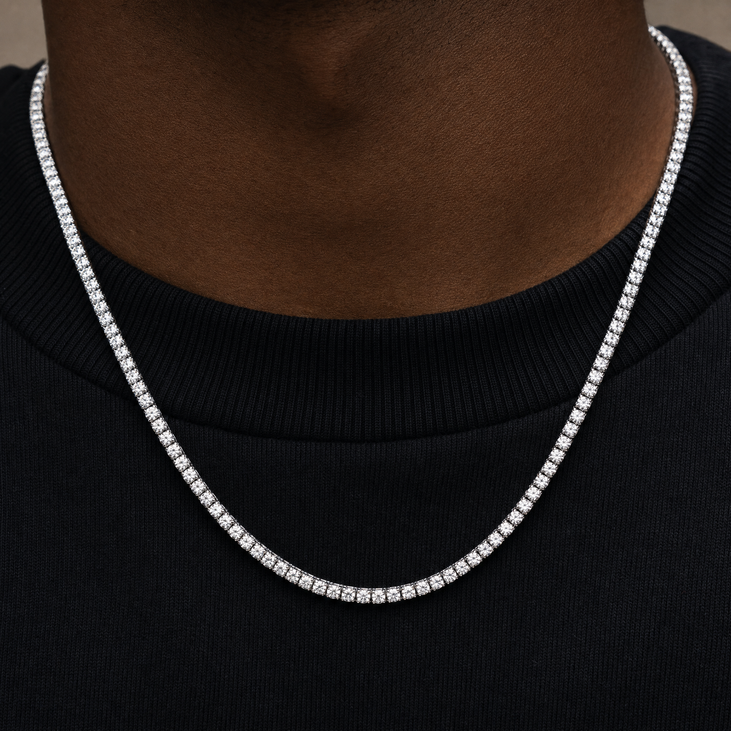 Close-up of simulated diamond tennis chain, 925 silver plated prong-set stones