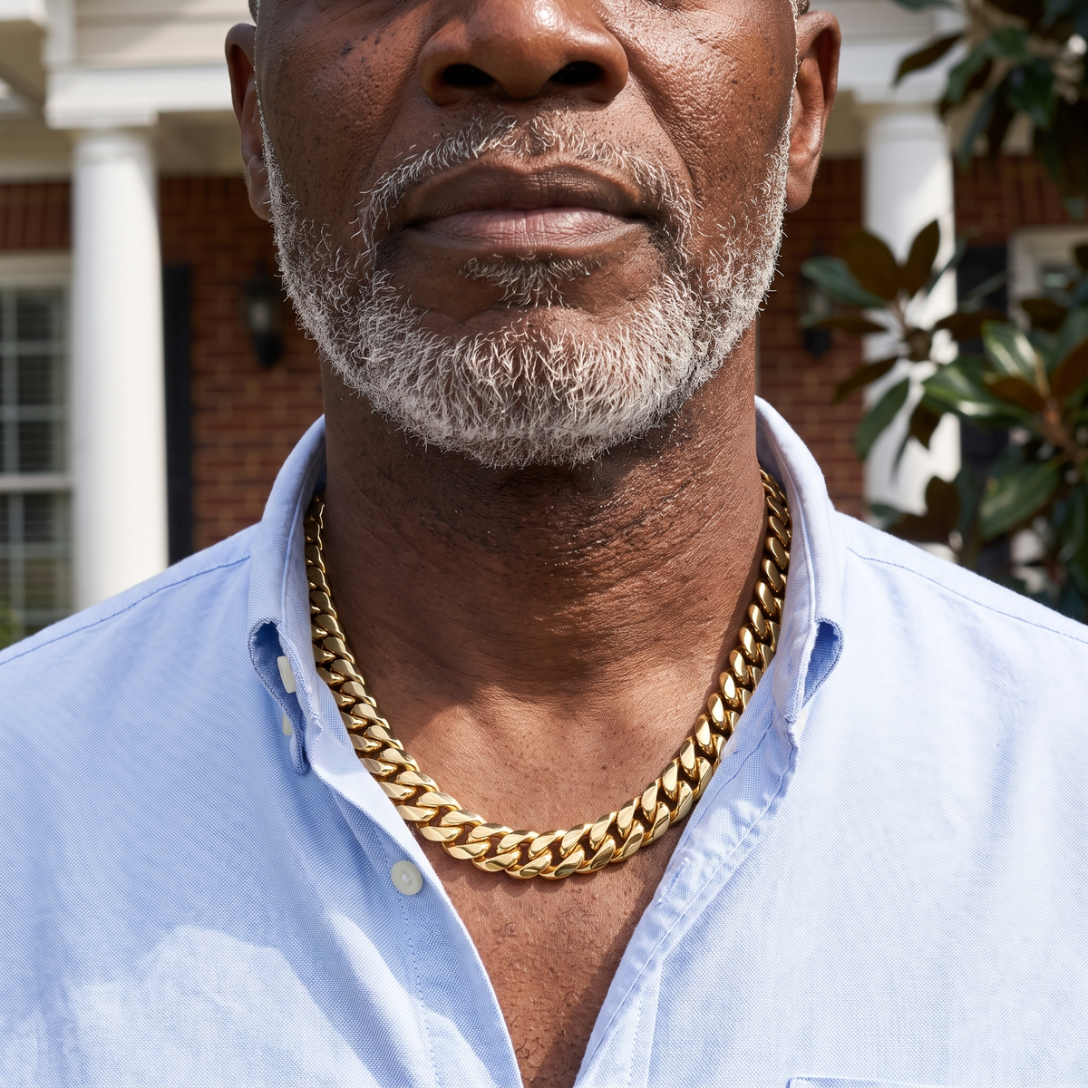 Older man wearing an 18K gold plated Saphir Miami Cuban link chain